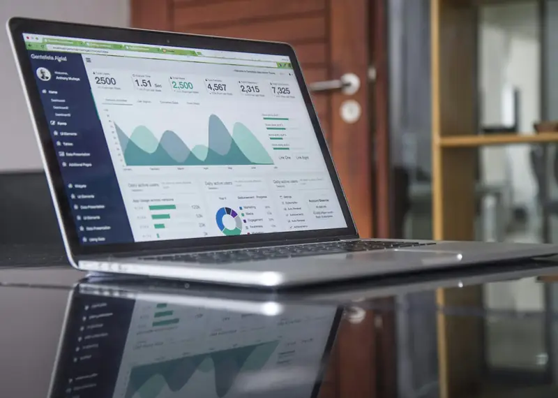 Laptop showing sales charts